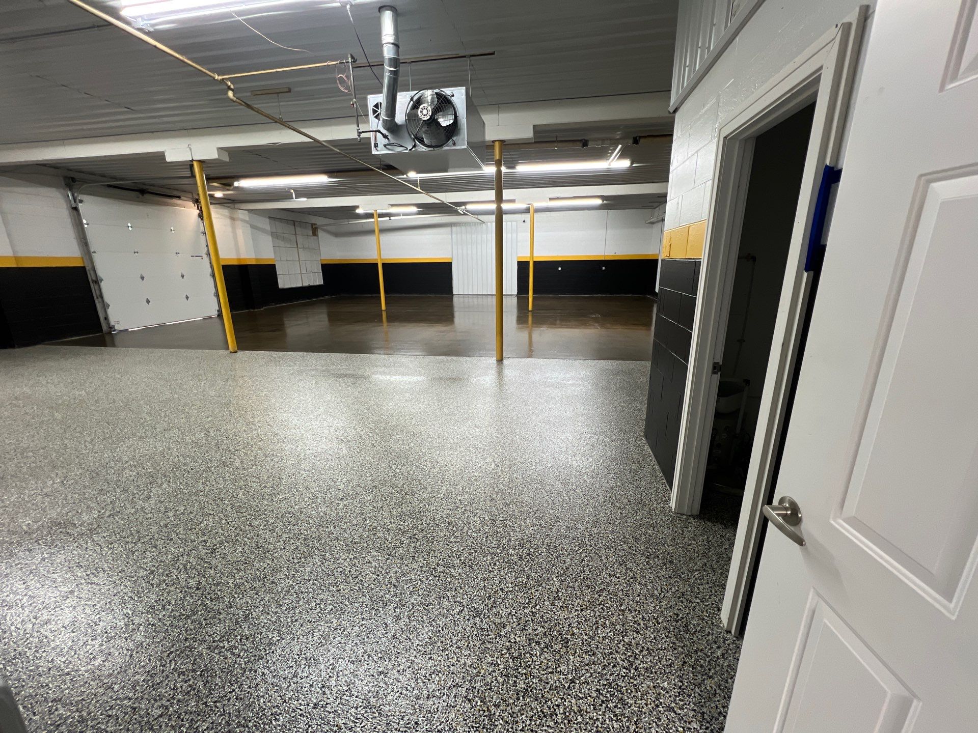 Commercial epoxy floor in a West Michigan warehouse or retail space